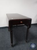 A Victorian mahogany Pembroke table fitted a drawer