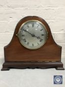 A mahogany cased Gilbert mantel clock with silvered dial,