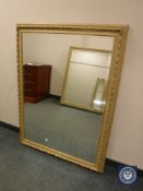 A contemporary gilt bevelled overmantel mirror 93 cm x 122 cm