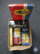 A box of vintage board games, Bayko converting set,