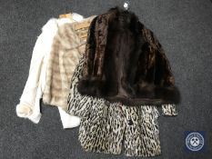 A fur coat together with two simulated fur coats and a sheepskin jacket