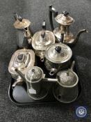 A tray of seven antique plated tea and coffee pots