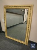 A contemporary gilt bevelled overmantel mirror 93 cm x 122 cm