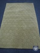 A hand tufted self embossed olive rug, 120 cm x 180 cm,