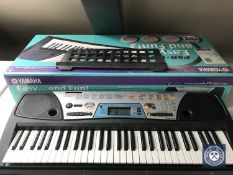 A boxed Yamaha PSR170 electric keyboard