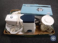 A box of Kenwood food mixer with accessories and an electric fondue pot