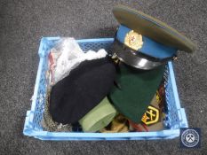 A crate of collection of Russian hats, Commando beret, gas mask,