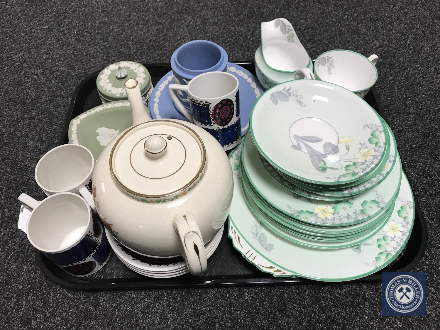 A tray of George VI silver jubilee teapot, Portmeirion coffee cups and saucers,