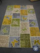 A contemporary butterfly pattern rug,
