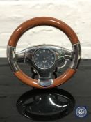A desk timepiece in the form of a steering wheel,