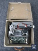 A cased vintage typewriter