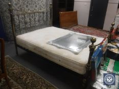 A 5' brass bed frame with a Hypnos mattress
