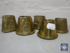 Five WWI trench art shells - three bearing military badges