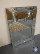 An all glass bevel edge mirror