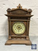 A mahogany and pine cased Junghans mantel clock with enamelled dial