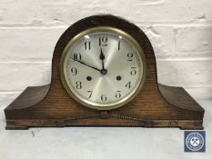 An oak cased Enfield mantel clock with pendulum
