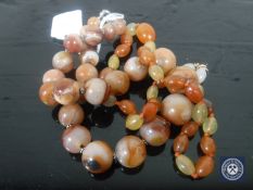 Two polished stone necklaces