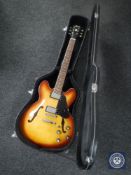 A Gibson 335 replica electric guitar in hard carry case