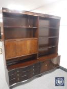 A twin section mahogany bureau bookcase fitted cupboards and drawers beneath