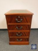 A reproduction two drawer filing chest with tooled leather top, width 49 cm.