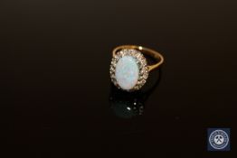 An 18ct gold opal and diamond cluster ring,