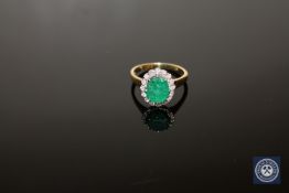 An 18ct gold emerald and diamond cluster ring, size O/P, 4.5g. CONDITION REPORT: 4.