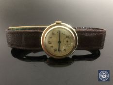A gent's vintage 9ct gold wristwatch on brown leather strap