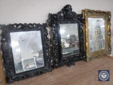 An ornate gilt framed mirror and two Rocco style mirrors