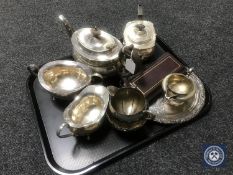 A tray of silver plated tea service, teapot,