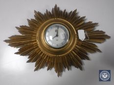 A Smith sunburst wall clock