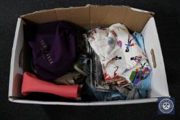 A box containing assorted material, lady's shoes, handbags including Radley and Ted Baker,