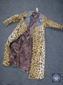 A vintage faux fur leopard print coat with leather collar
