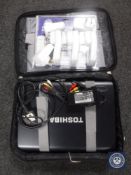 A Toshiba lap top with charger in case,