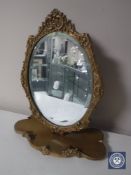 A 20th century ornate gilt framed dressing table mirror