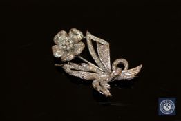 A platinum and diamond floral spray brooch