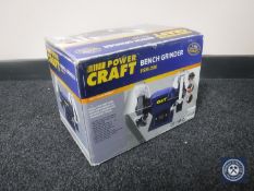 A boxed Powercraft bench grinder