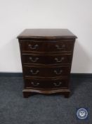 A mahogany Regency style serpentine fronted four drawer chest