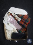 A box of vintage clothing including gloves, Scottish kilt, blouse,