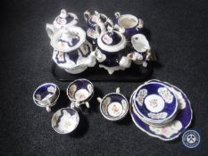 A tray containing twenty-one pieces of Victorian lustre tea china