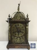 A late 19th century oak and brass lantern clock