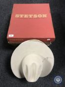 A Stetson hat box containing four Stetsons
