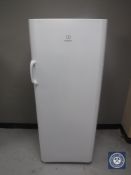 An Indesit upright fridge