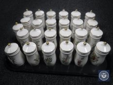 A pine spice rack containing twenty-five flower fairies spice jars