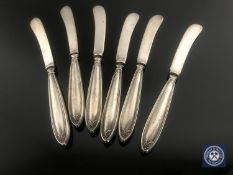 A set of six silver-handled butter knives