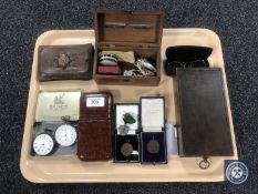 A tray of silver pocket watch, embossed leather cigar case, medals and coins,