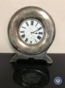 An oversized pocket watch contained within a silver watch stand CONDITION REPORT: