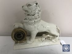 An early 20th century Staffordshire style lion mantel clock