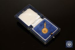 A 9ct gold charm - Lucky Frying Pan, boxed.