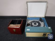 A mid 20th century electric table top record player and a case of 45's - 60's and later