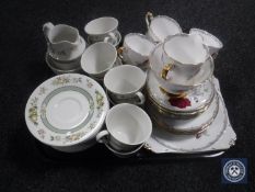 A tray of twenty-six pieces of Royal Doulton Tonkin tea service and twenty-one pieces of Royal